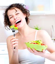 Woman enjoying healthy meal as part of her oral health routine