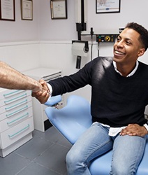 man shaking hands with his dentist