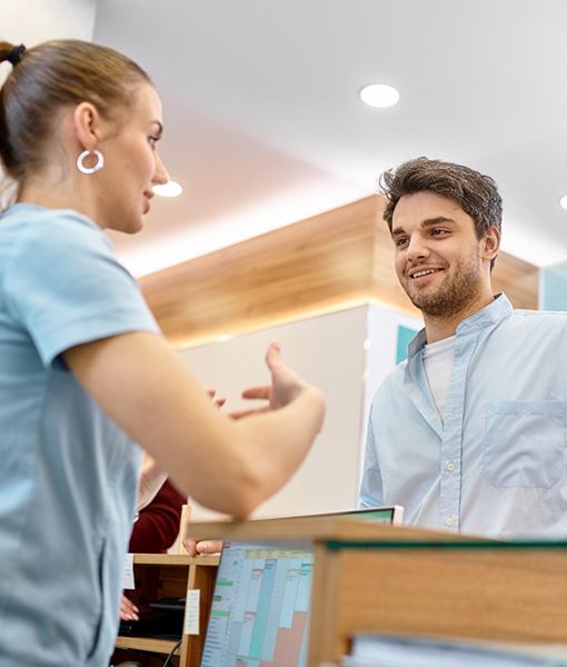 Smiling patient asking about cosmetic dentistry in Edmonton