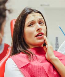 Woman in dental chair with dental emergency in Edmonton