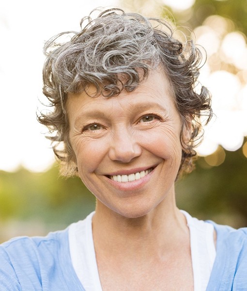 Woman with dentures in Edmonton