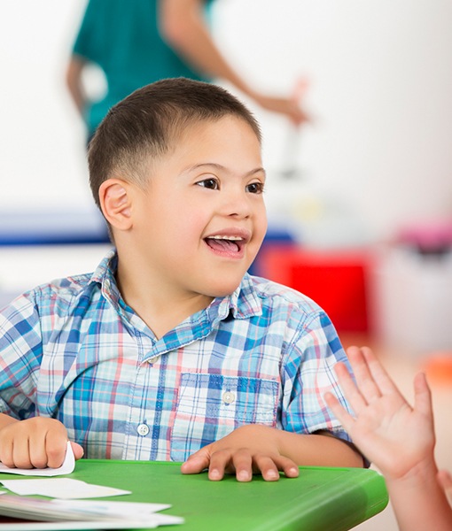 Little boy smiling after special needs dentistry