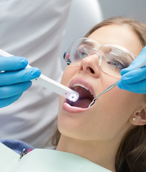 Patient receiving an oral cancer screening