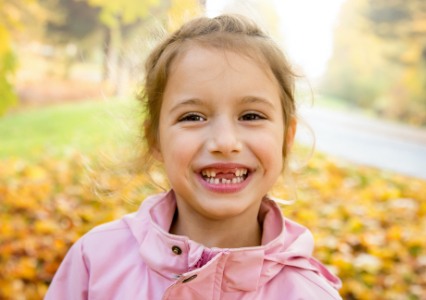 Little girl with healthy smile thanks to children's dentistry