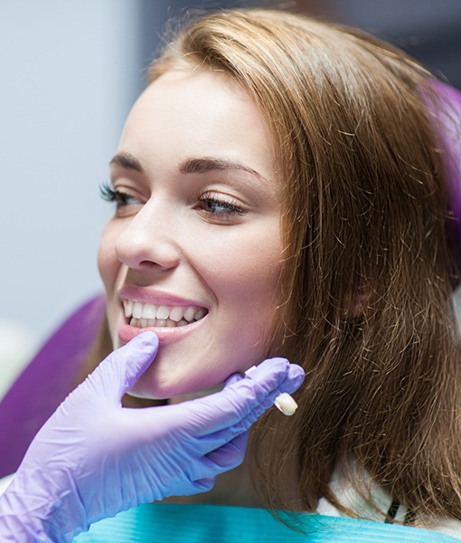 man putting on occlusal splint 